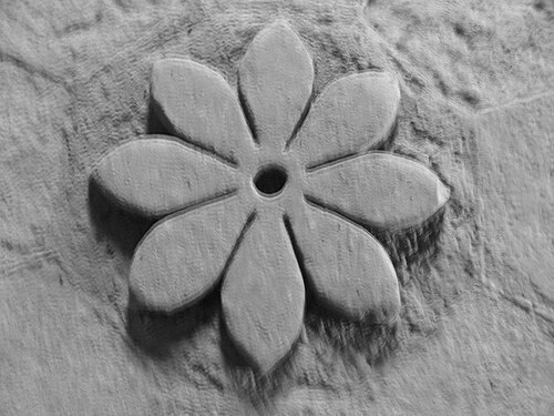 Flower carved out of stone 1